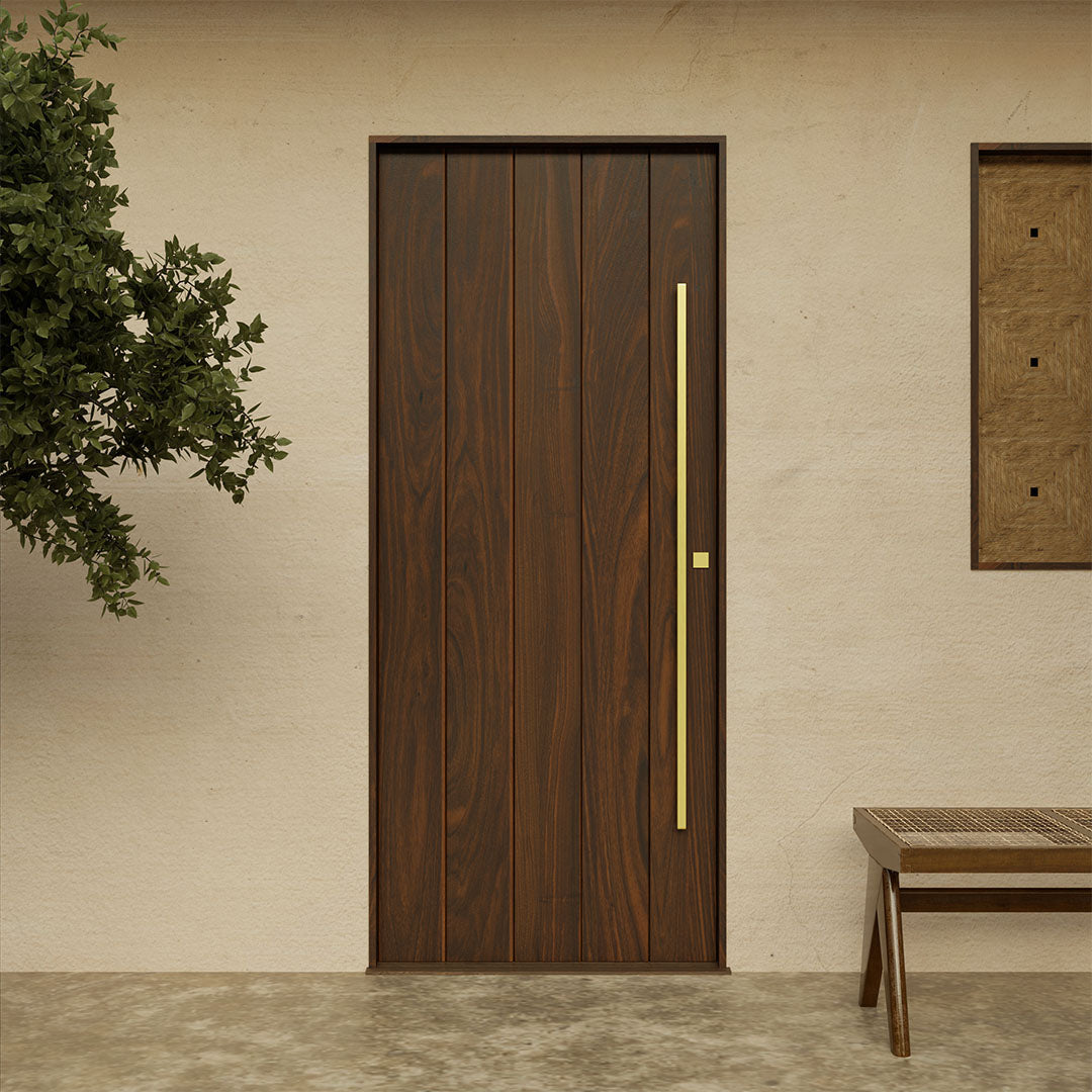 Modern walnut exterior front door with vertical plank design and sleek brass pull handle, handcrafted by RealCraft.